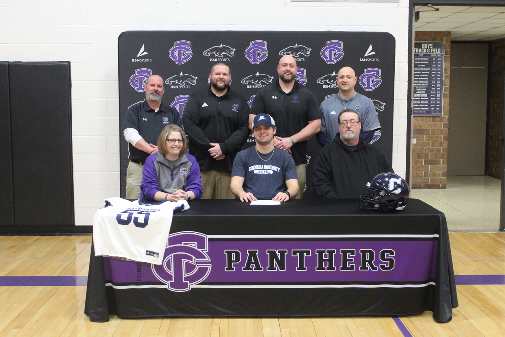 Carson with family and coaches